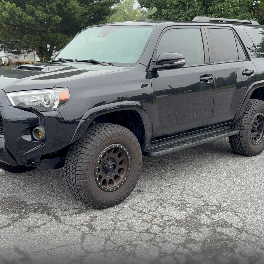 Black Toyota 4Runner before ceramic coating — flat, swirled paint