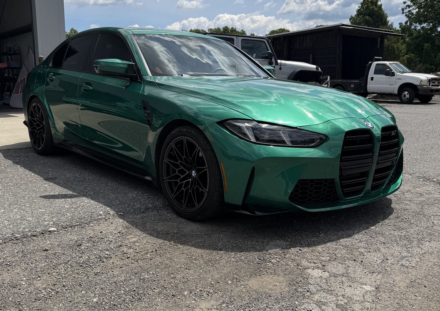 Green BMW M3 (G80) after ceramic coating — deep, glossy mirror-like finish