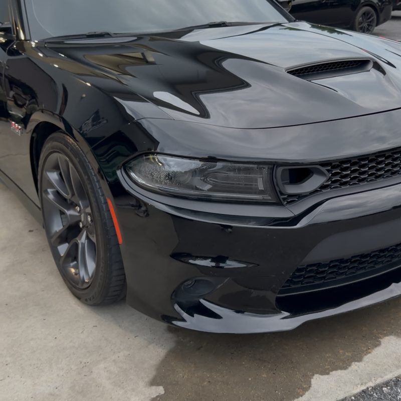 Dodge Charger after ceramic coating — deep, glossy mirror-like black finish